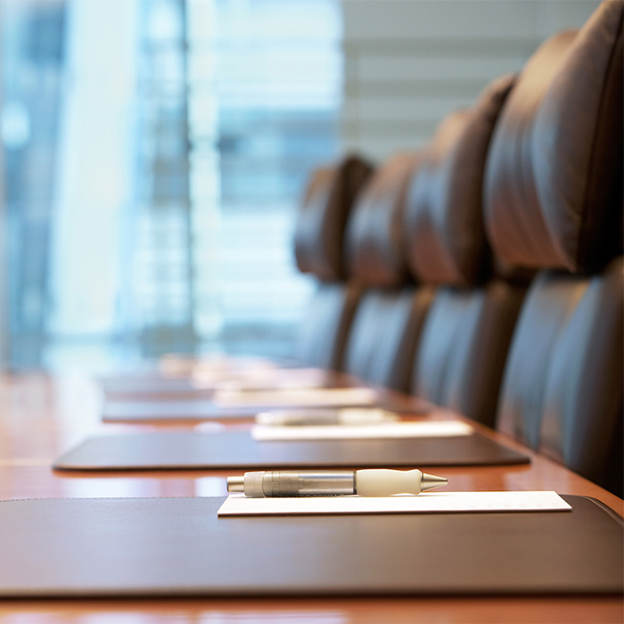photo of a board room place setting in soft focus